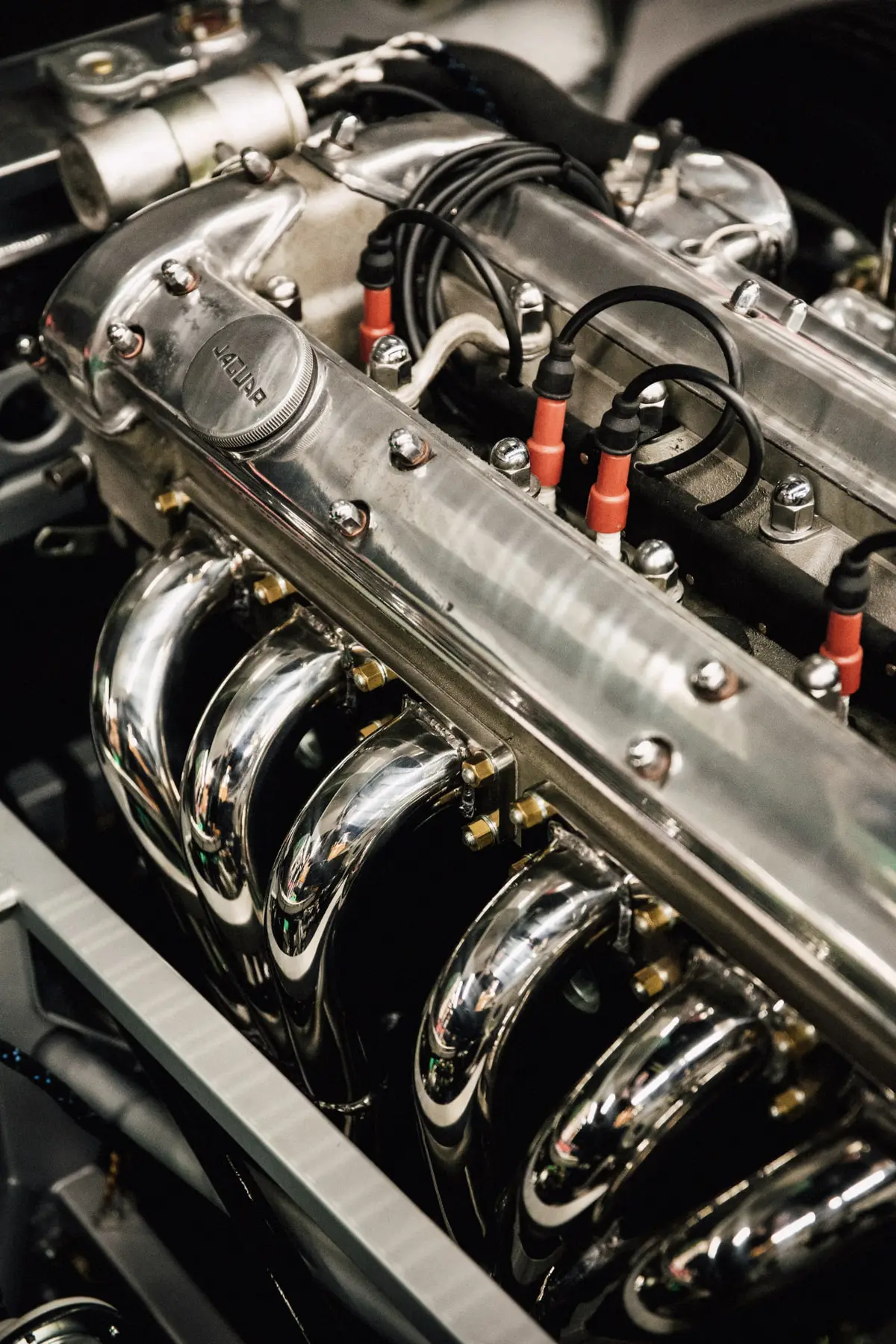 Marine engine bay with intake manifold, fuel lines and ignition leads serviced by Mora Engine