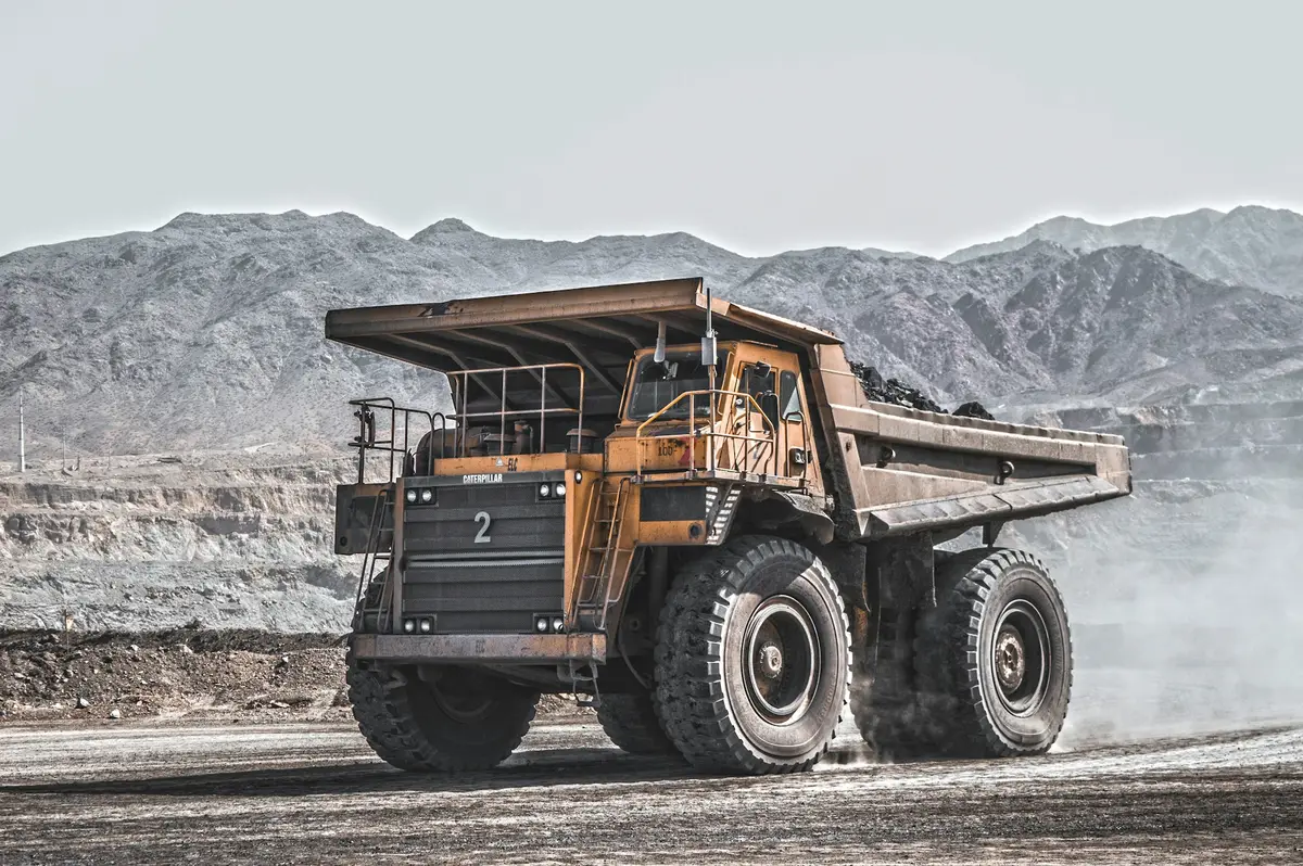 Haul truck working an open pit mine — mining fleet engine support